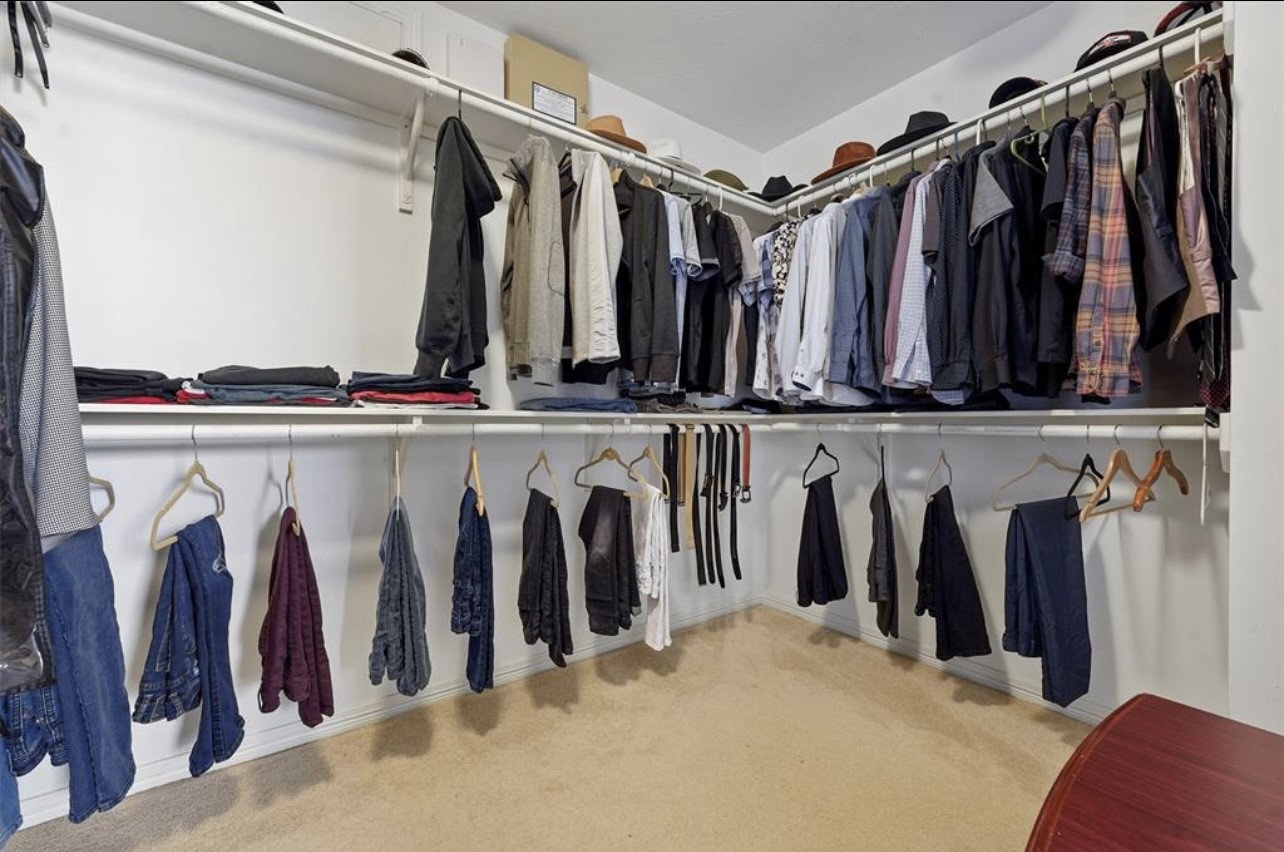 2646 Couch Street Houston, TX 77008 - Photo 13 of 21 a view of walk in closet with clothes