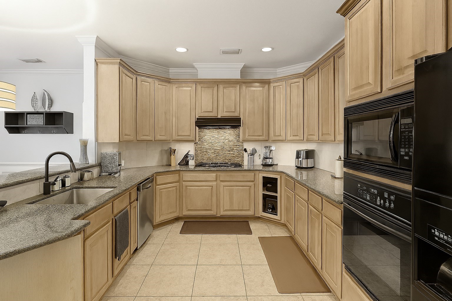 2646 Couch Street Houston, TX 77008 - Photo 3 of 21 a kitchen with stainless steel appliances granite countertop a sink and cabinets