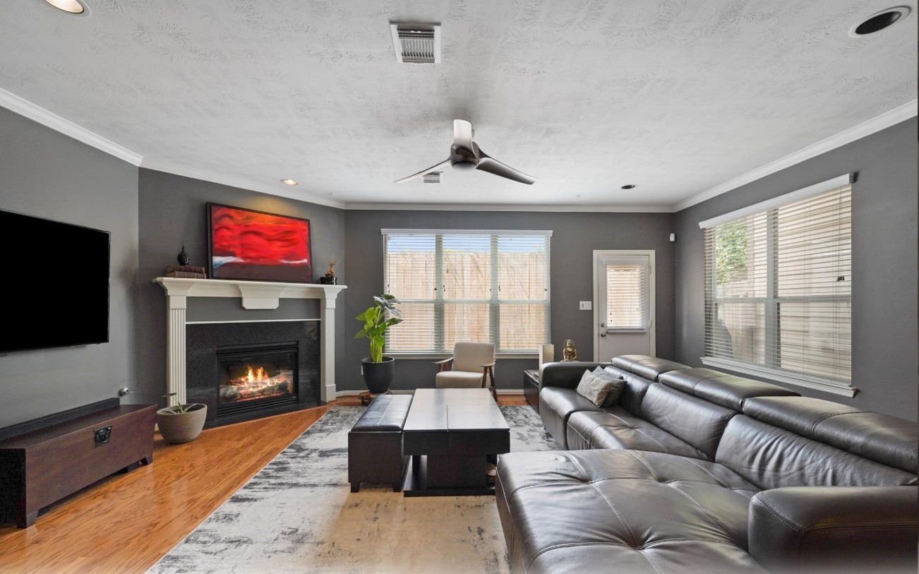 2646 Couch Street Houston, TX 77008 - Photo 6 of 21 a living room with furniture window and a fireplace