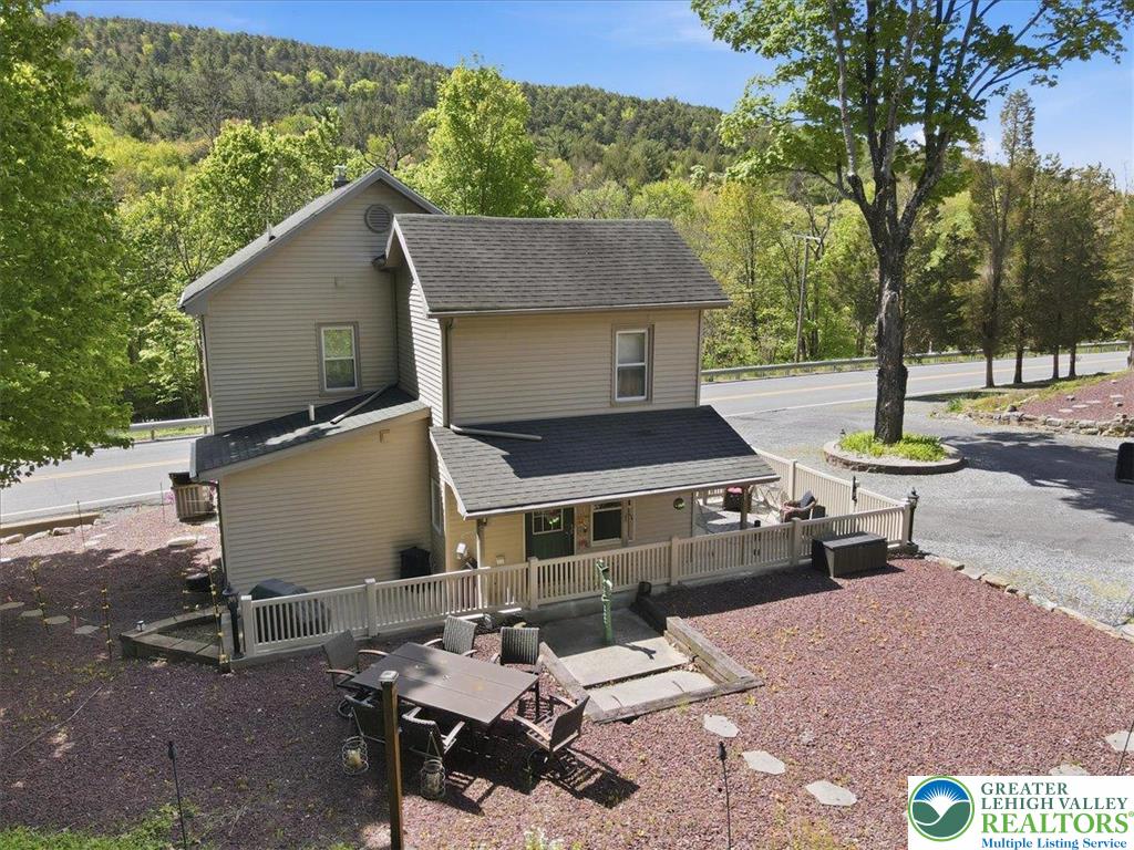 4880 Little Gap Road Kunkletown, PA 18058 - Photo 76 of 100 This charming home offers comfortable living with a private outdoor space, perfect for enjoying the natural surroundings.
