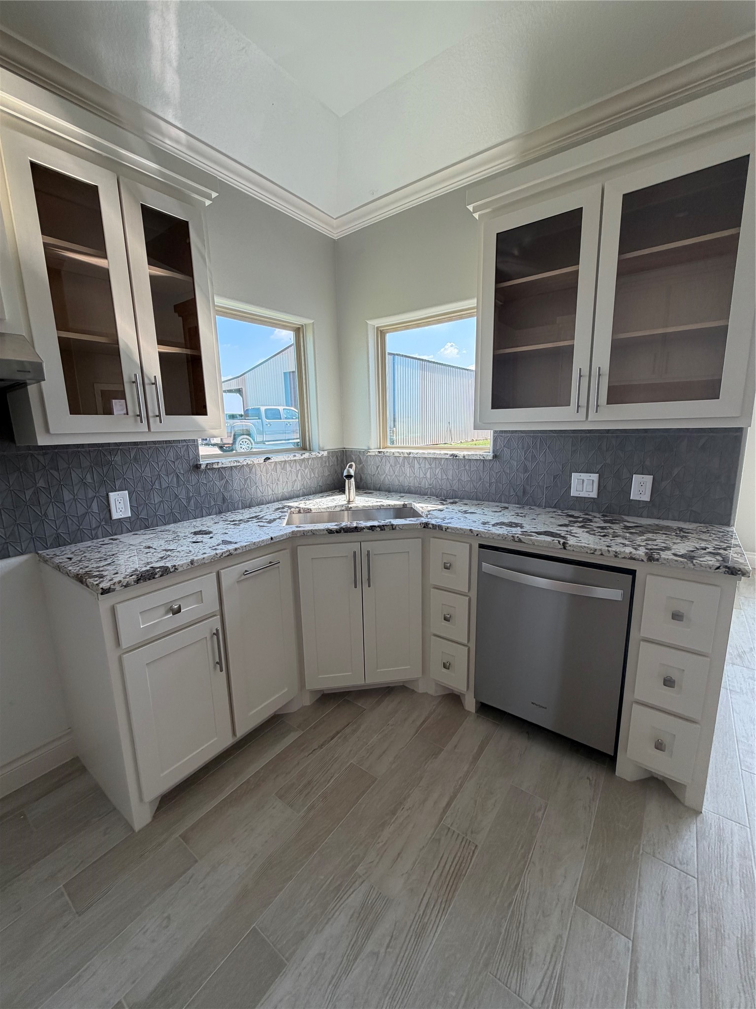 749 Buffalo Trail Angleton, TX 77515 - Photo 11 of 30 a kitchen with stainless steel appliances granite countertop a sink and cabinets