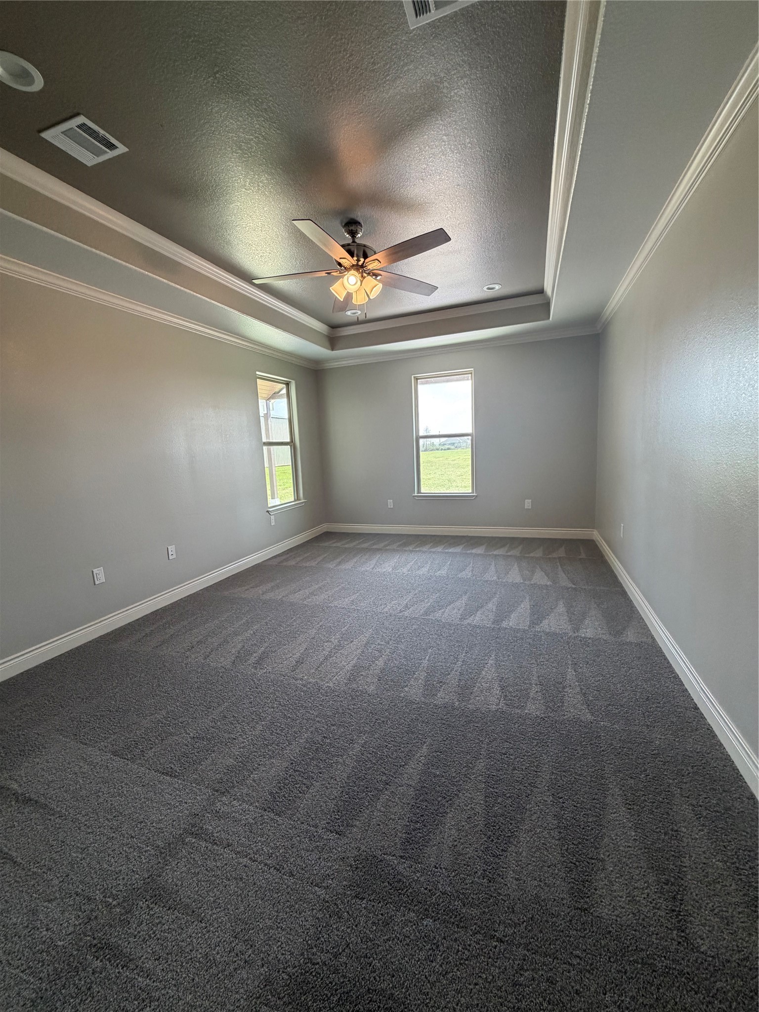 749 Buffalo Trail Angleton, TX 77515 - Photo 14 of 30 an empty room with windows and ceiling fan