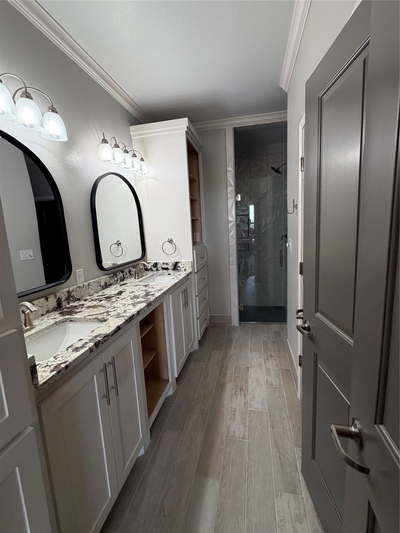 749 Buffalo Trail Angleton, TX 77515 - Photo 23 of 30 a bathroom with a granite countertop double vanity sink and a mirror