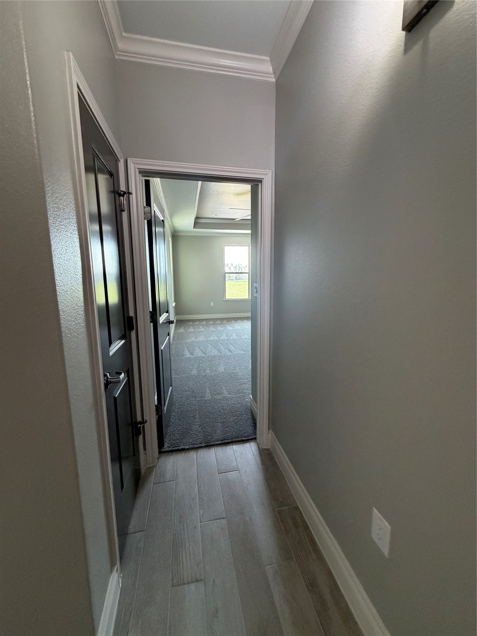 749 Buffalo Trail Angleton, TX 77515 - Photo 24 of 30 an empty room with wooden floor and a mirror