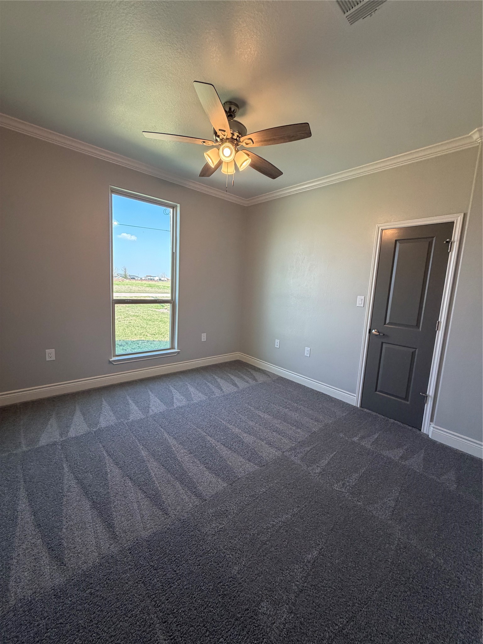 749 Buffalo Trail Angleton, TX 77515 - Photo 25 of 30 an empty room with windows and fan