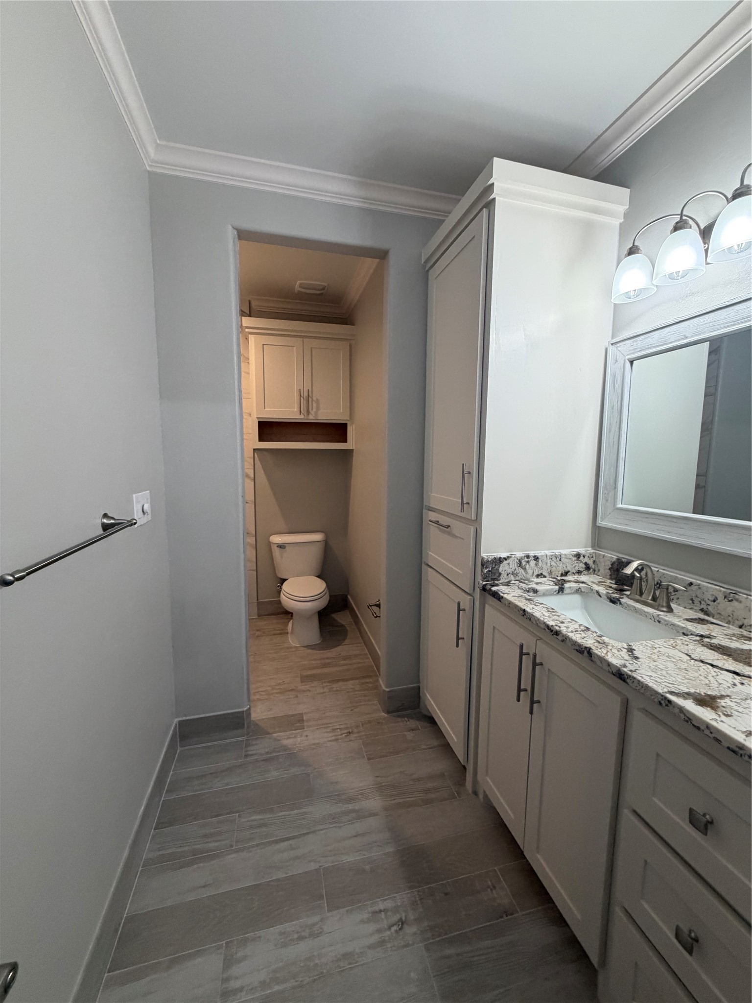 749 Buffalo Trail Angleton, TX 77515 - Photo 28 of 30 a bathroom with a sink and a mirror