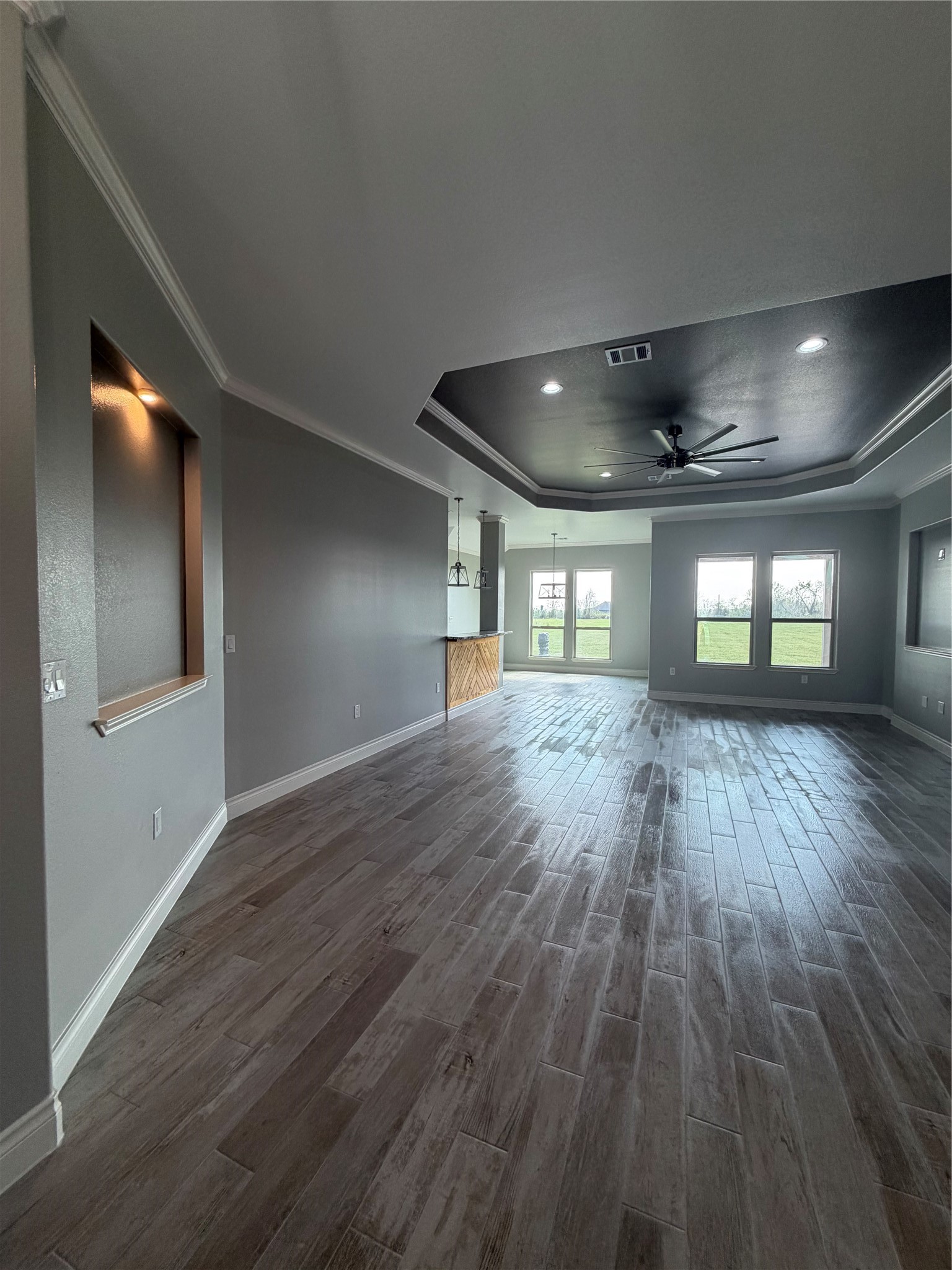 749 Buffalo Trail Angleton, TX 77515 - Photo 30 of 30 an empty room with wooden floor and windows