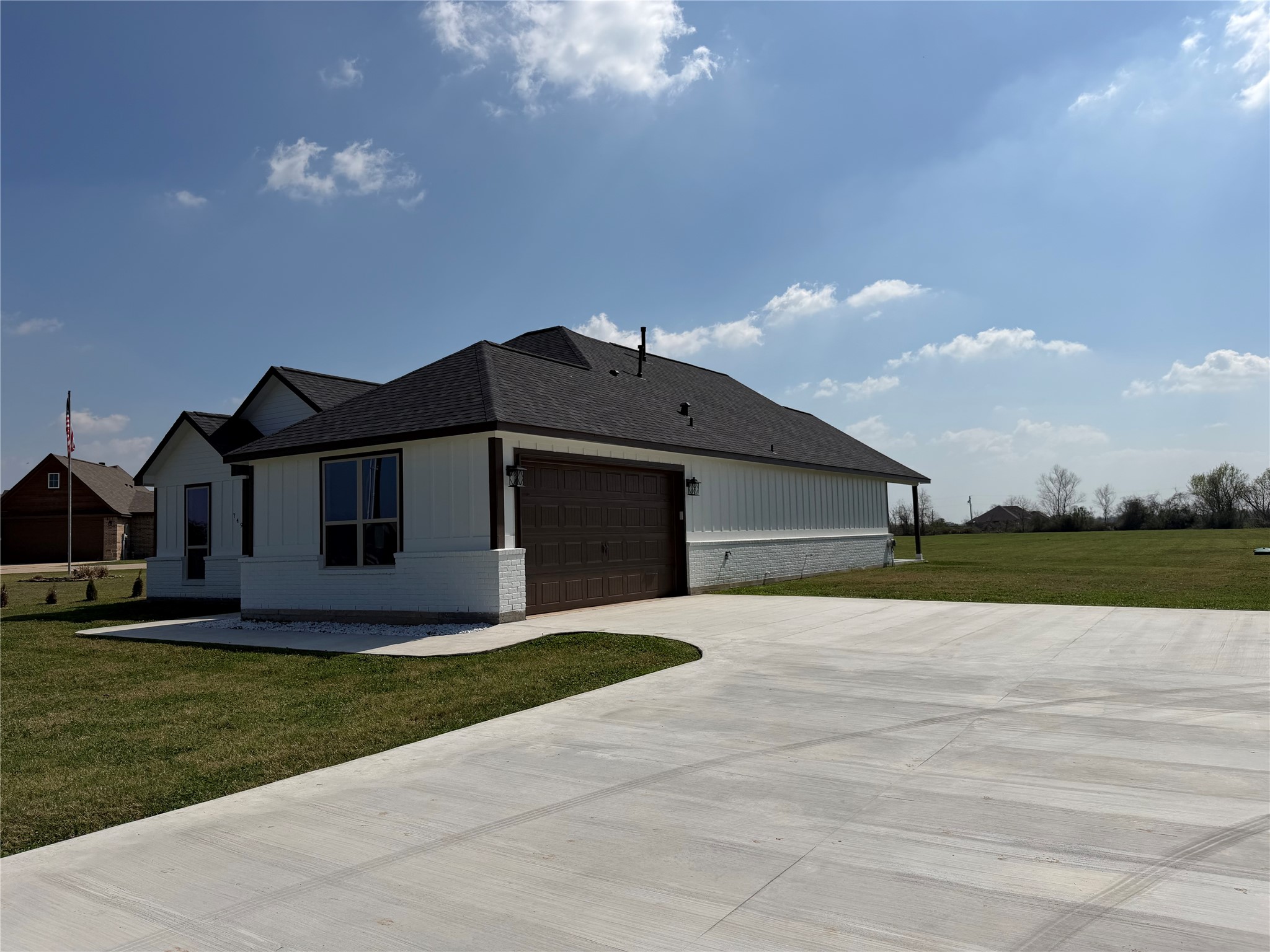 749 Buffalo Trail Angleton, TX 77515 - Photo 3 of 30 a front view of a house with a yard and garage