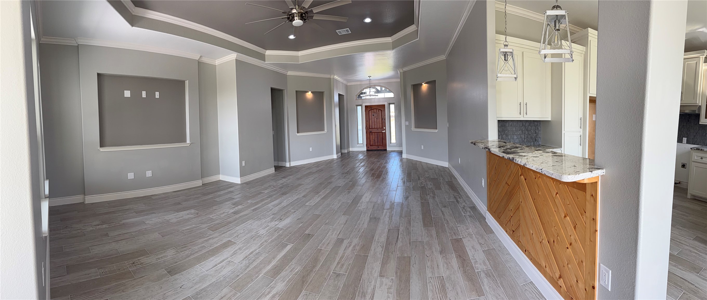 749 Buffalo Trail Angleton, TX 77515 - Photo 9 of 30 a view of a hallway with wooden floor and a bathroom