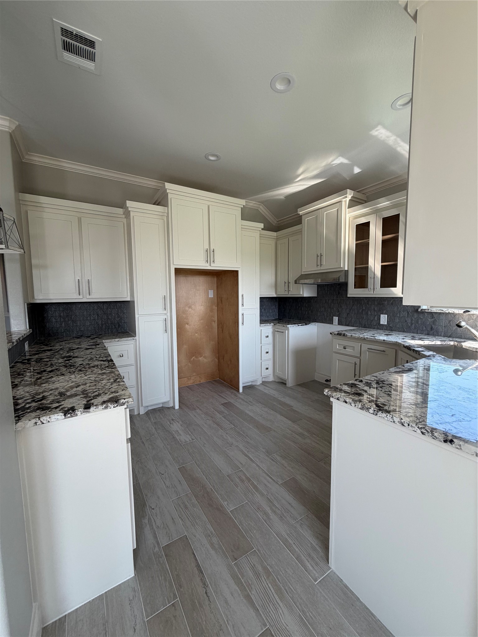 749 Buffalo Trail Angleton, TX 77515 - Photo 10 of 30 a kitchen with stainless steel appliances granite countertop a sink stove and refrigerator