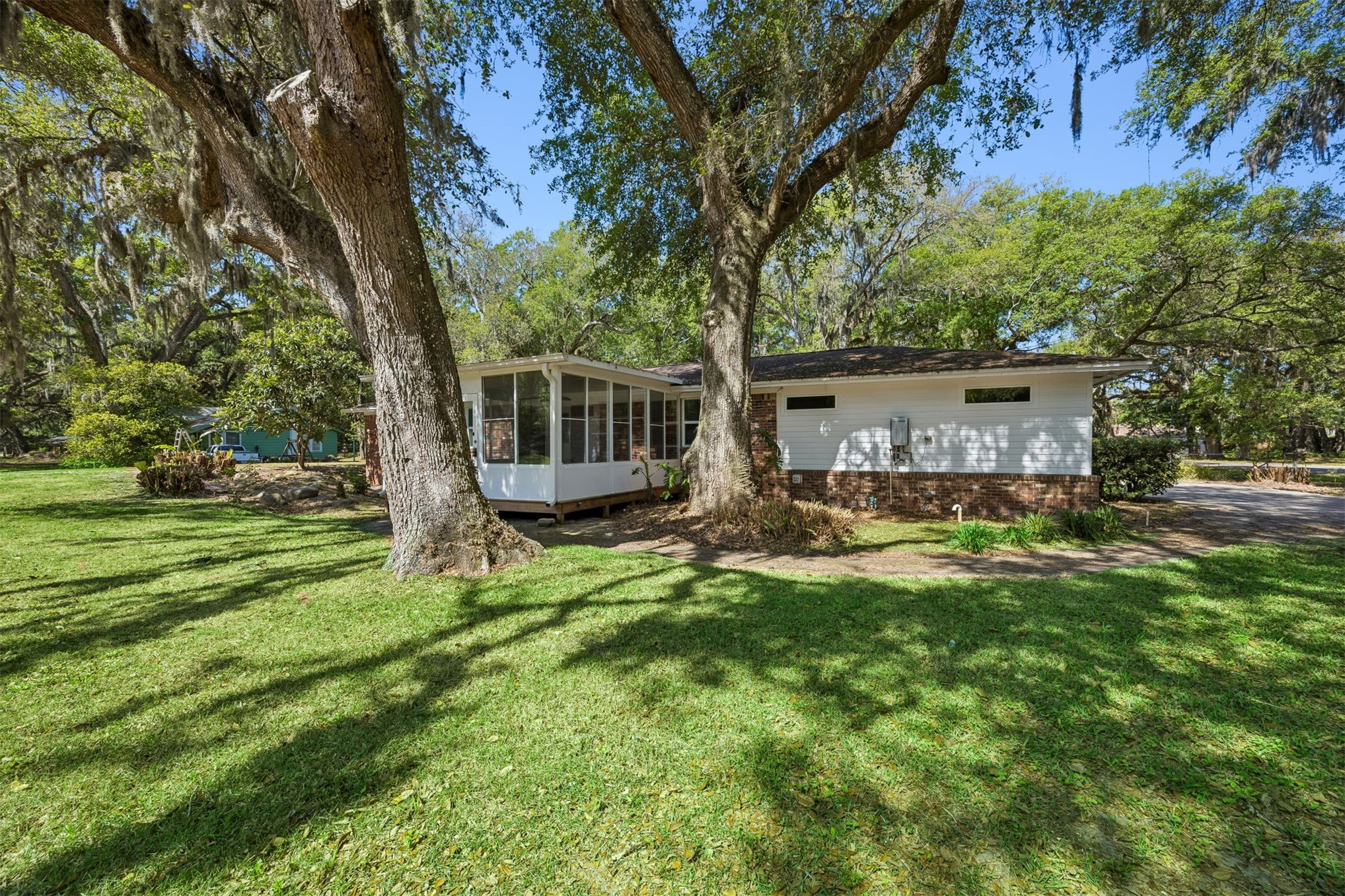 2441 Amelia Road Fernandina Beach, FL 32034 - Photo 9 of 36 a view of a house with backyard and a tree