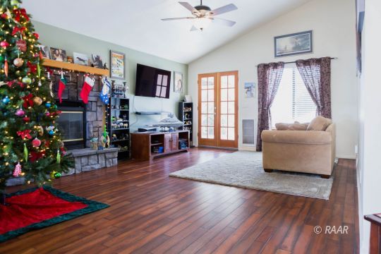 809 Charles Court Ridgecrest, CA 93555 - Photo 8 of 33 a living room with furniture and a flat screen tv