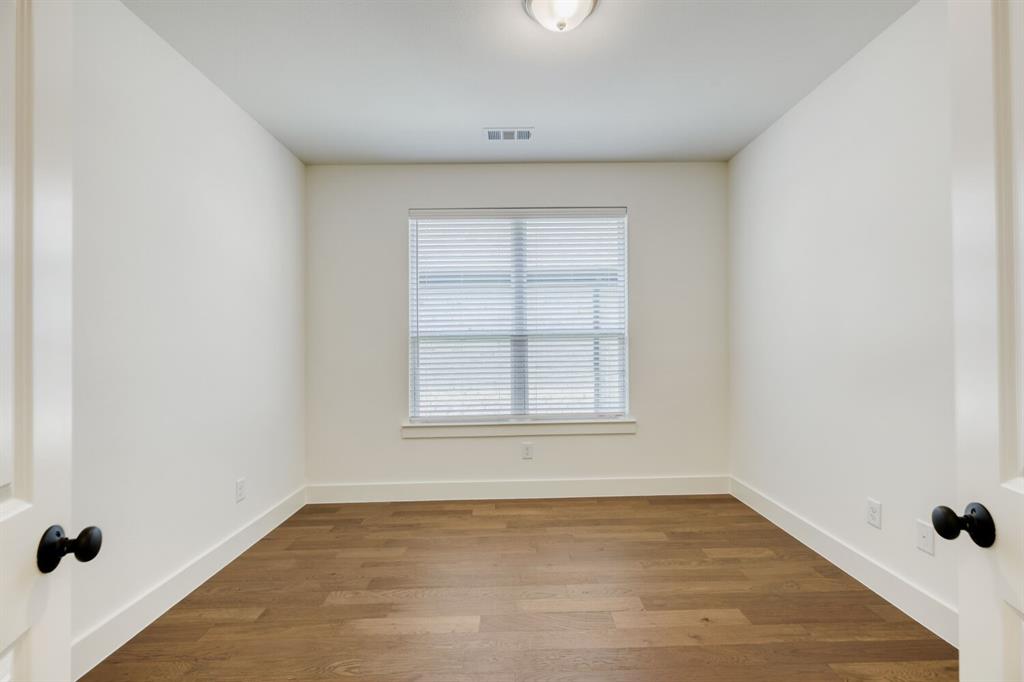 4314 Haley Way Oak Point, TX 75068 - Photo 7 of 28 Room featuring wood-finish flooring, white walls, and a single window with blinds
