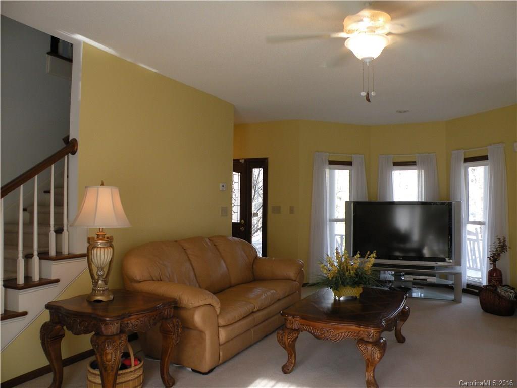2717 Farmstead Lane, Unit 61 Fort Mill, SC 29708 - Photo 15 of 23 a living room with furniture and a flat screen tv