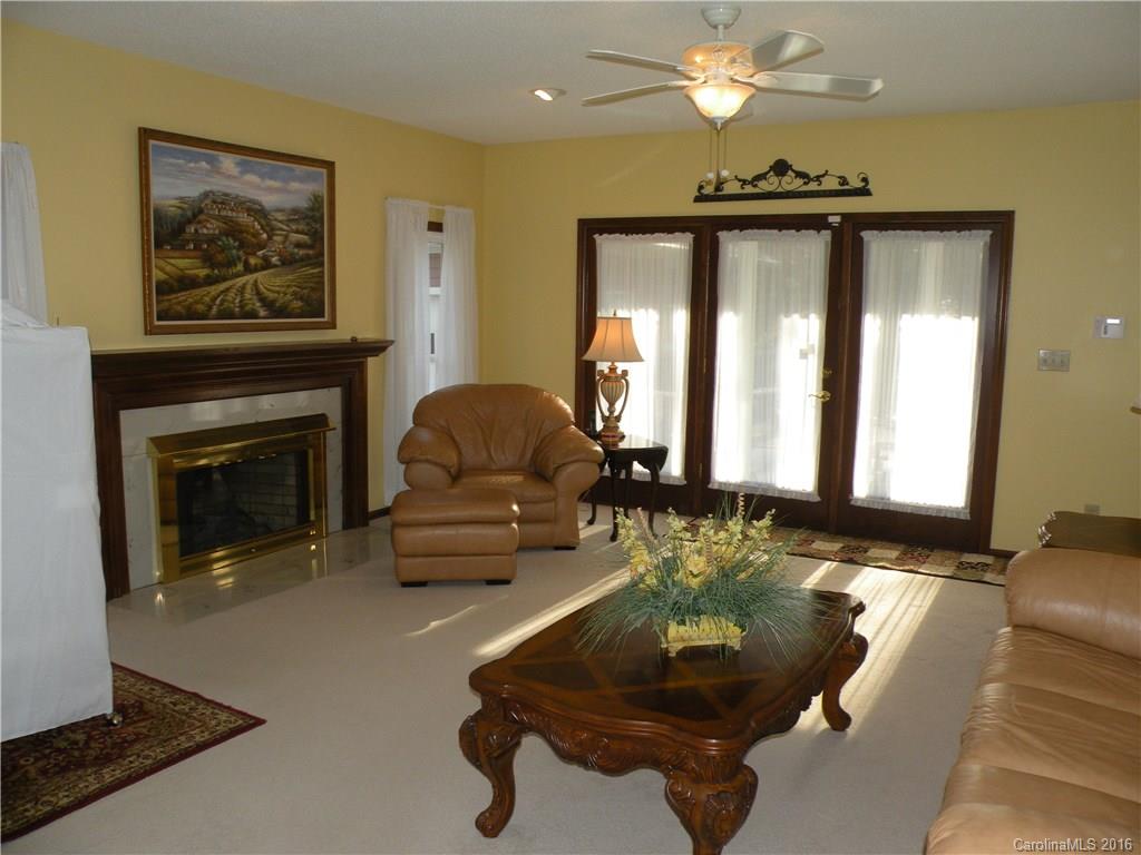 2717 Farmstead Lane, Unit 61 Fort Mill, SC 29708 - Photo 19 of 23 a living room with furniture and a fireplace