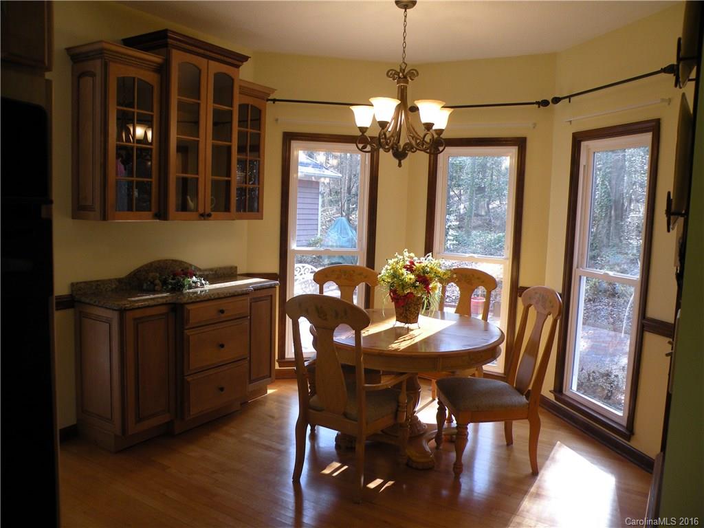 2717 Farmstead Lane, Unit 61 Fort Mill, SC 29708 - Photo 20 of 23 a view of a dining room with furniture window and wooden floor