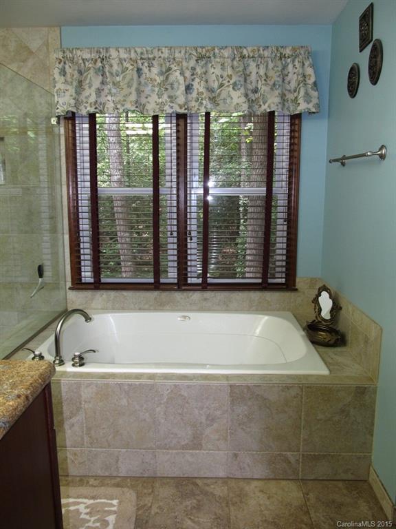 2717 Farmstead Lane, Unit 61 Fort Mill, SC 29708 - Photo 7 of 23 a bathroom with a window and a shower