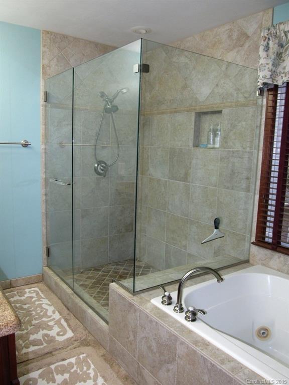 2717 Farmstead Lane, Unit 61 Fort Mill, SC 29708 - Photo 8 of 23 a bathroom with a sink and a shower