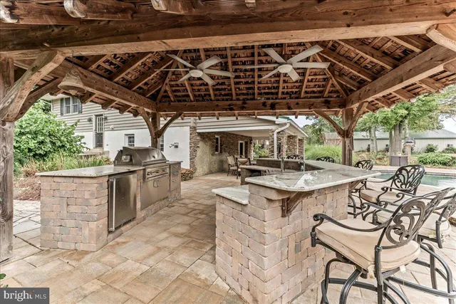 a balcony with furniture and a potted plant