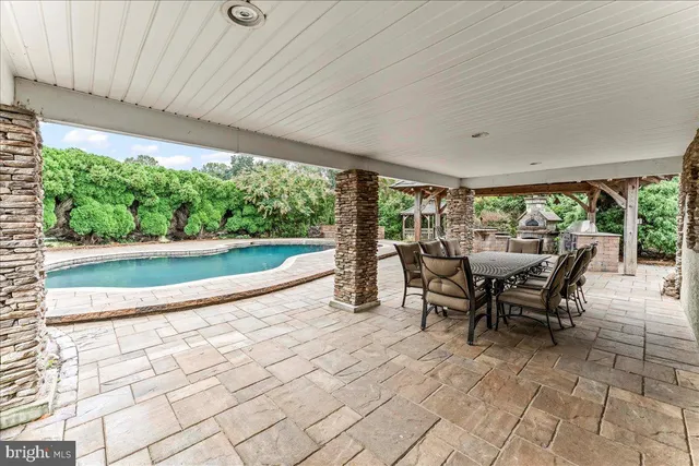a view of a chairs and table in the patio