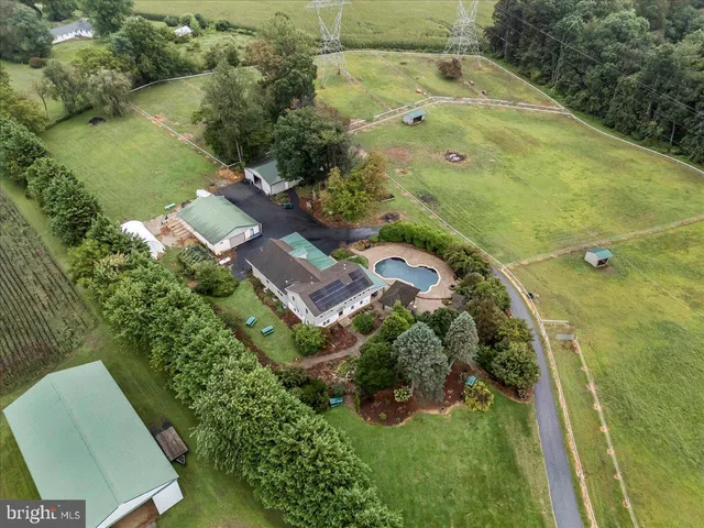 a large kitchen with stainless steel appliances lots of counter space and wooden floor