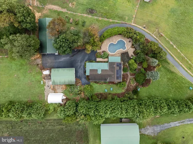 a view of a livingroom with wooden floor and staircase