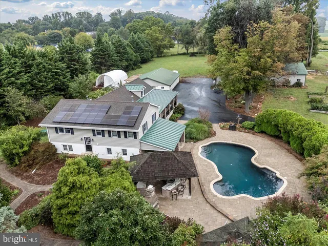 an empty room with a window and a ceiling fan
