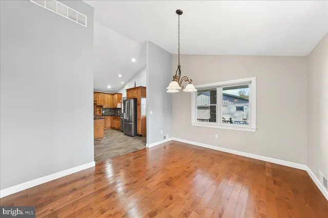 a view of a livingroom with a ceiling fan and window