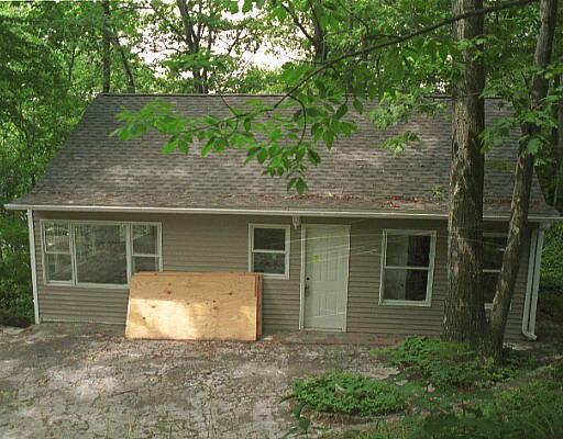 a house with trees in the background