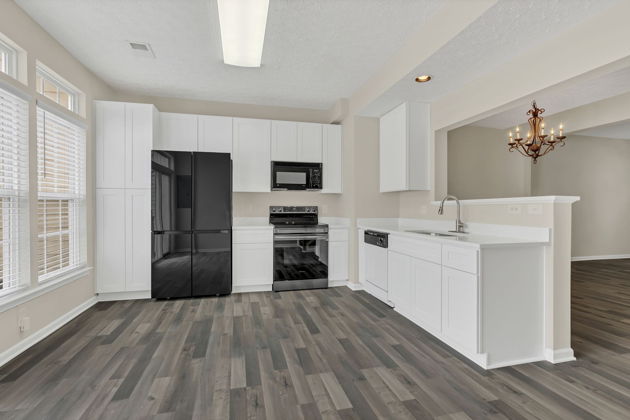 7714 Porter House Drive Nashville, TN 37211 - Photo 11 of 39 a kitchen with a refrigerator and a stove top oven