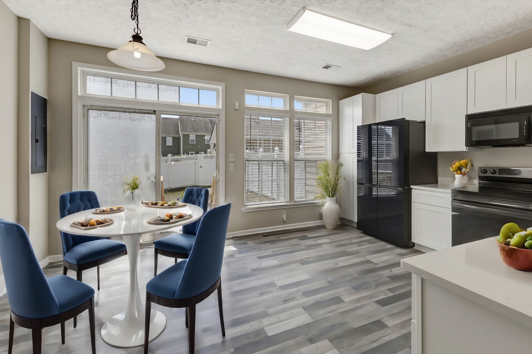 7714 Porter House Drive Nashville, TN 37211 - Photo 15 of 39 a dining room with furniture a chandelier and wooden floor