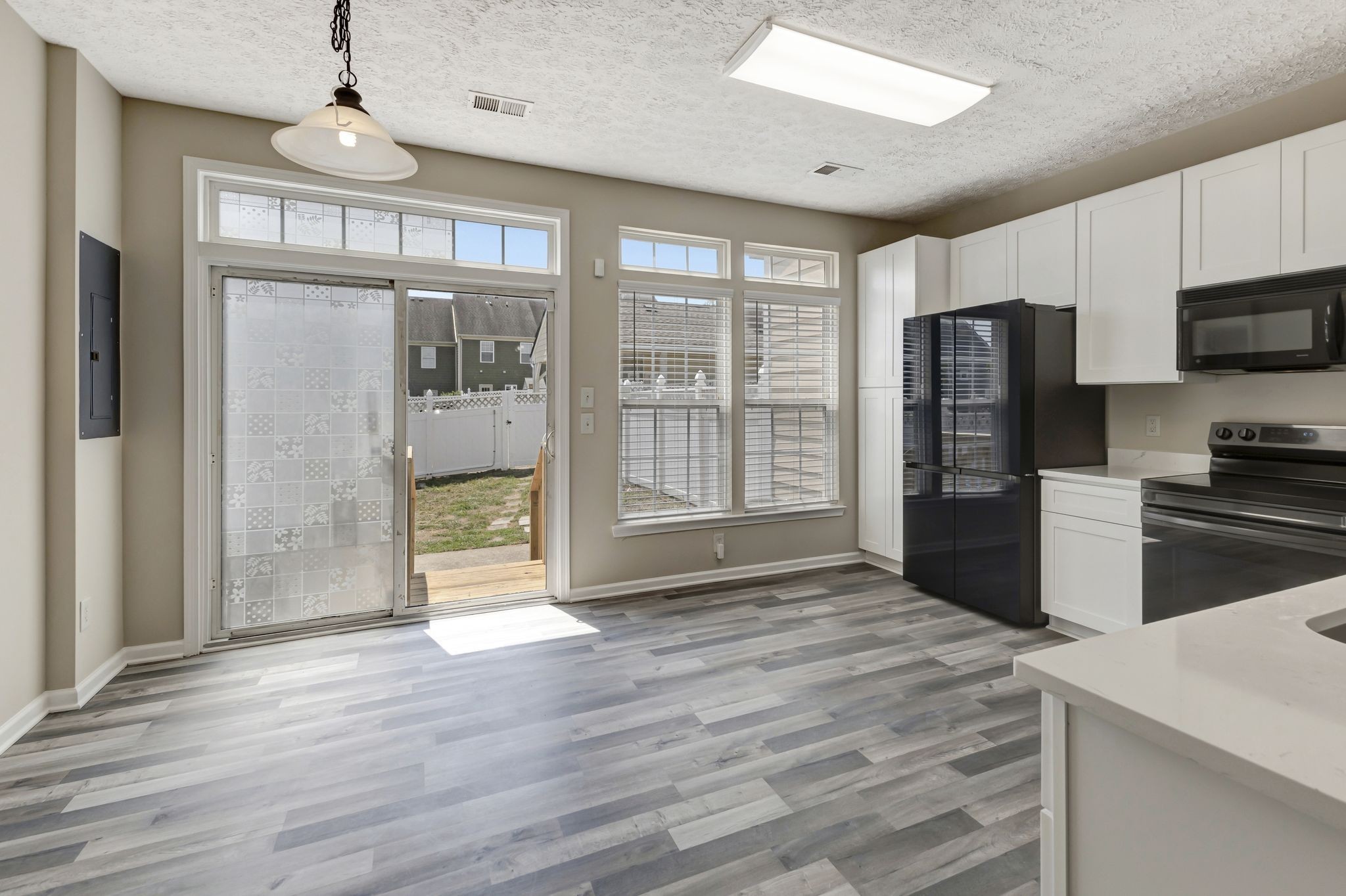 7714 Porter House Drive Nashville, TN 37211 - Photo 16 of 39 a view of kitchen with stainless steel appliances granite countertop a refrigerator a stove and a wooden floors