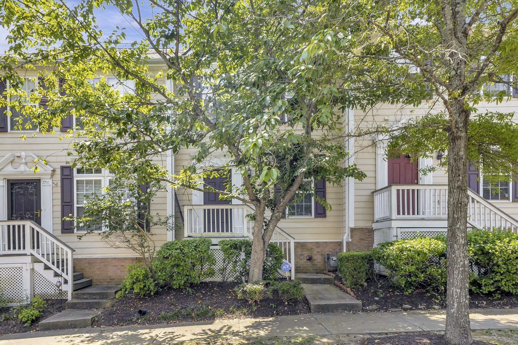 7714 Porter House Drive Nashville, TN 37211 - Photo 3 of 39 a front view of a house with garden