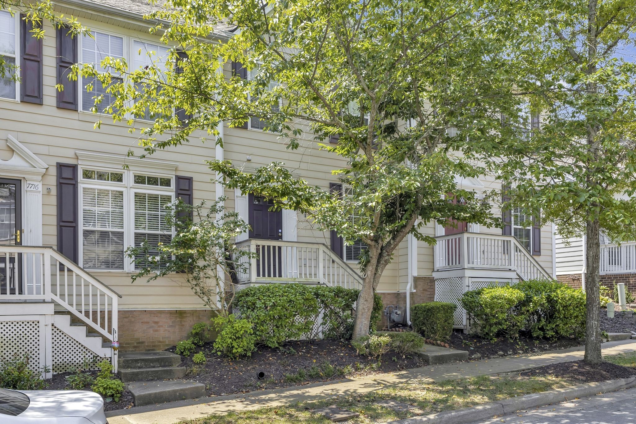 7714 Porter House Drive Nashville, TN 37211 - Photo 4 of 39 a front view of a house with garden