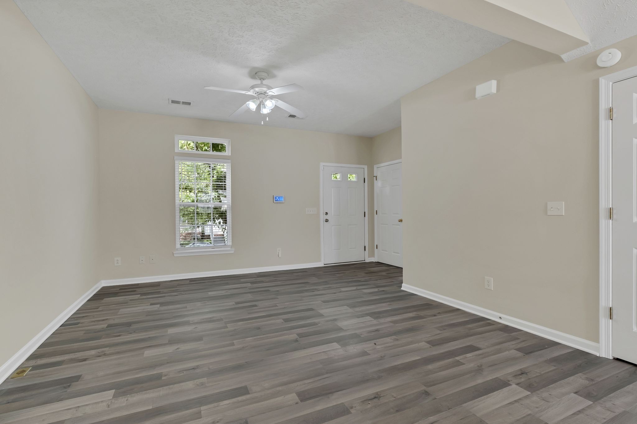 7714 Porter House Drive Nashville, TN 37211 - Photo 8 of 39 wooden floor in an empty room with a window