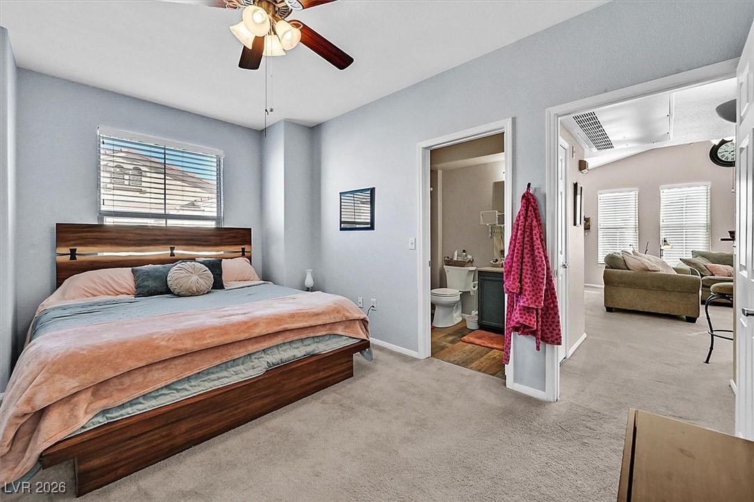 10550 West Alexander Road, Unit 2065 Las Vegas, NV 89129 - Photo 20 of 27 Bedroom with carpet, a ceiling fan, and ensuite bathroom