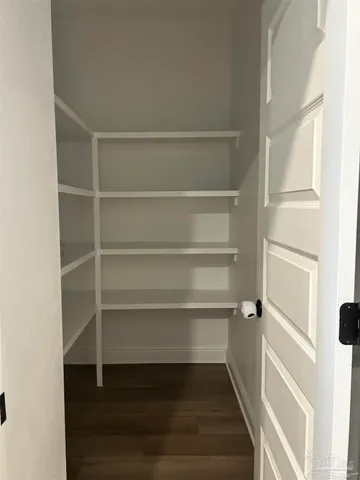 a white toilet sitting next to a bath tub