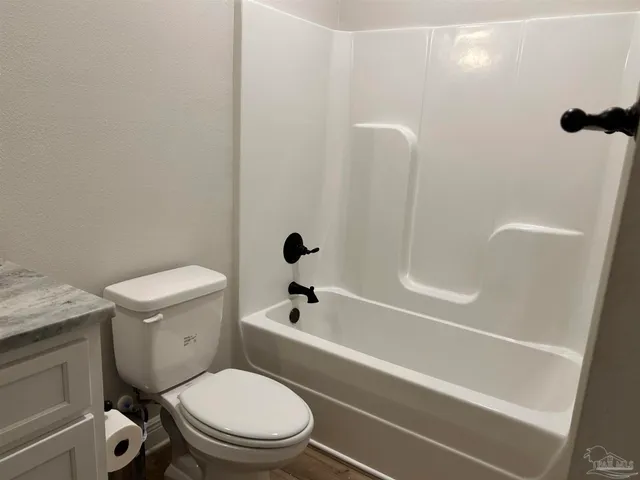 a view of a garage with a white roof