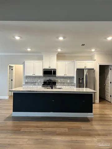 a view of storage and utility room with empty racks