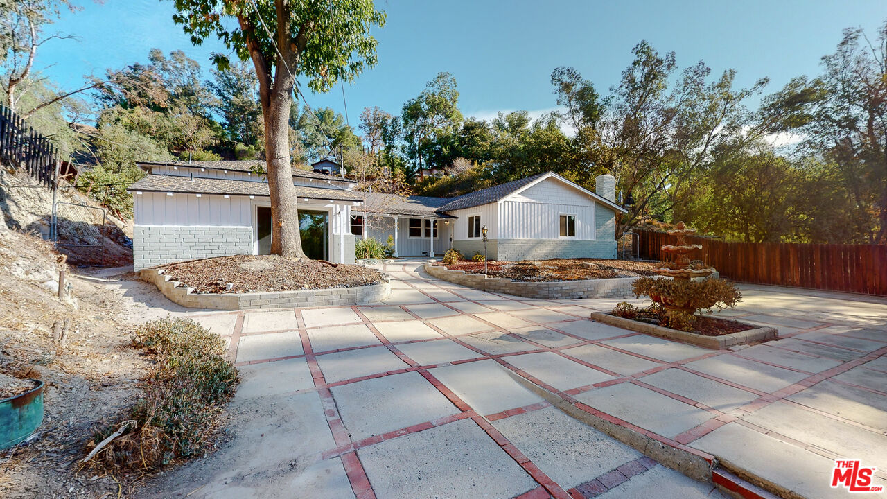 7865 Denivelle Road Sunland, CA 91040 - Photo 2 of 54 a front view of a house with garden