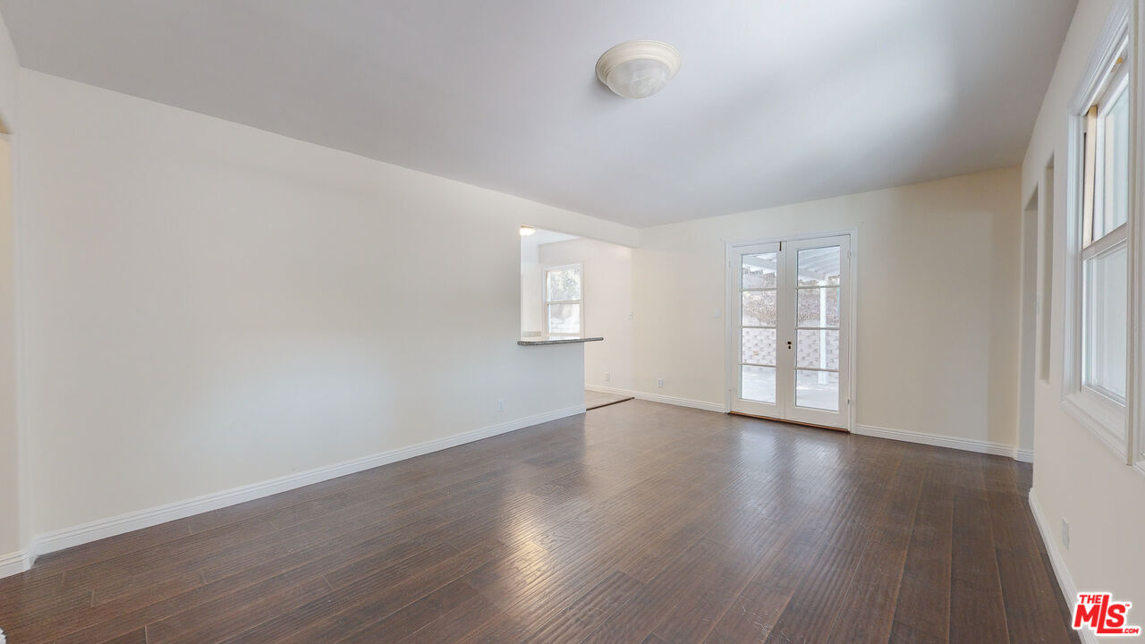 7865 Denivelle Road Sunland, CA 91040 - Photo 17 of 54 an empty room with wooden floor and windows