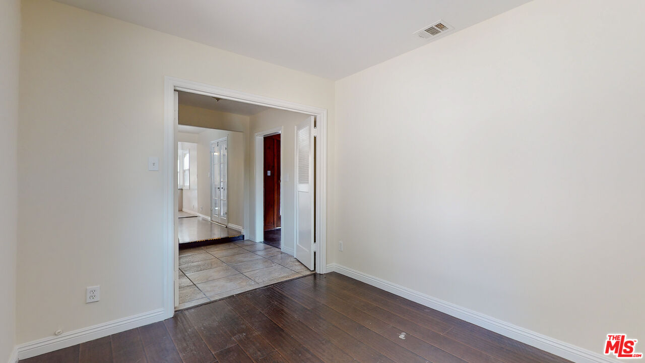 7865 Denivelle Road Sunland, CA 91040 - Photo 23 of 54 a view of an empty room with wooden floor