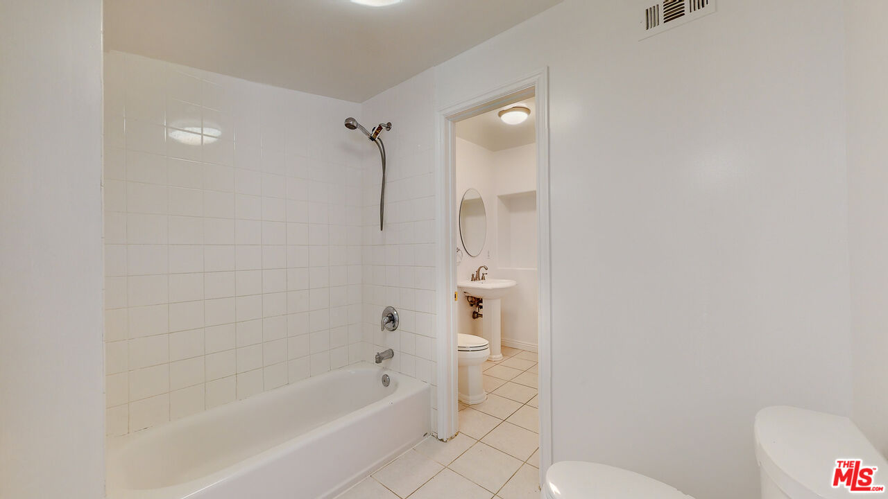 7865 Denivelle Road Sunland, CA 91040 - Photo 37 of 54 a bathroom with a bathtub and a shower