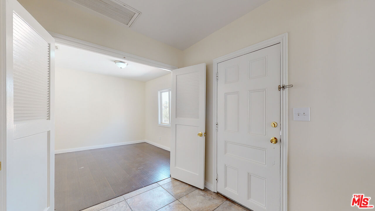7865 Denivelle Road Sunland, CA 91040 - Photo 9 of 54 a view of a hallway with wooden floor