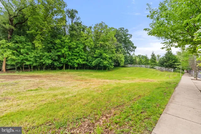 a view of a swimming pool and a yard