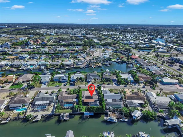a front view of a house with a garden and yard