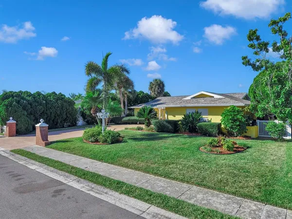 a kitchen with a sink and large window