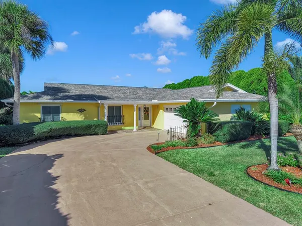 a kitchen with stainless steel appliances granite countertop a refrigerator sink and stove