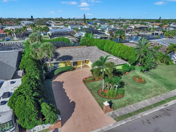 an aerial view of a houses with outdoor space and street view