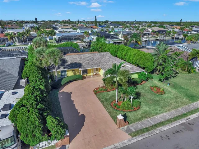 an aerial view of a houses with outdoor space and street view